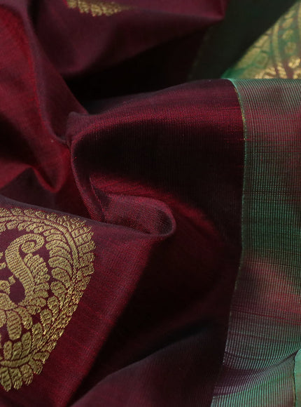 Pure kanchipuram silk saree deep maroon and dual shade of green with zari woven buttas and rich zari woven border