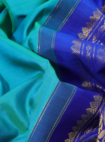 Pure kanchipuram silk saree dual shade of teal bluish green and blue with zari woven buttas and long rich zari woven border