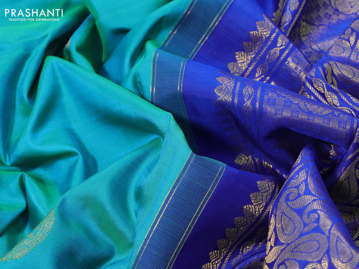 Pure kanchipuram silk saree dual shade of teal bluish green and blue with zari woven buttas and long rich zari woven border