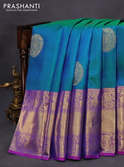 Pure kanchipuram silk saree dual shade of teal blue and purple with zari woven buttas and annam zari woven border