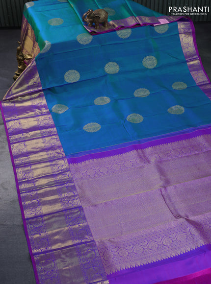 Pure kanchipuram silk saree dual shade of teal blue and purple with zari woven buttas and annam zari woven border