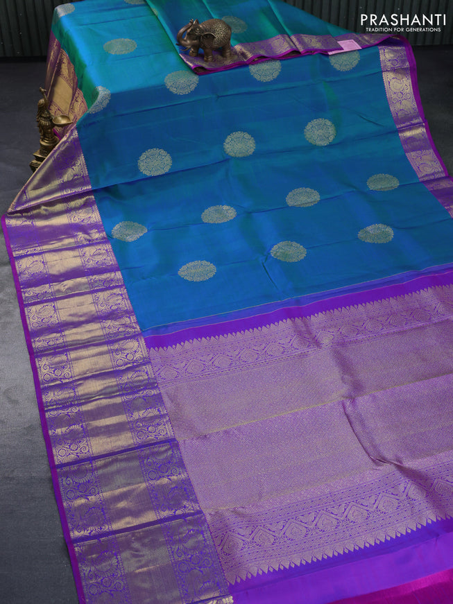 Pure kanchipuram silk saree dual shade of teal blue and purple with zari woven buttas and annam zari woven border