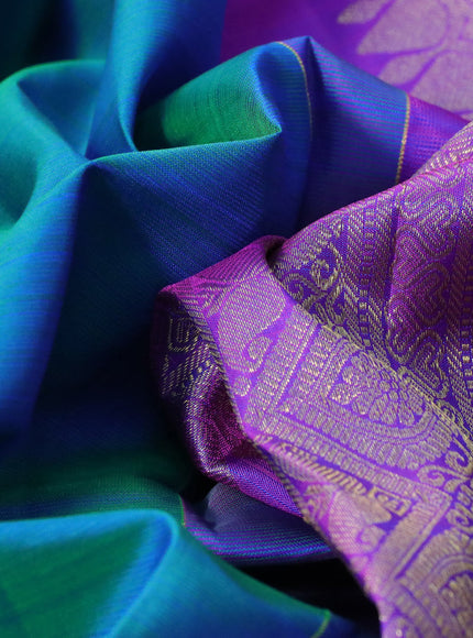 Pure kanchipuram silk saree dual shade of teal blue and purple with zari woven buttas and annam zari woven border