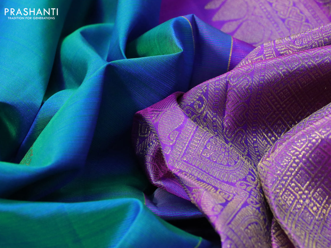 Pure kanchipuram silk saree dual shade of teal blue and purple with zari woven buttas and annam zari woven border