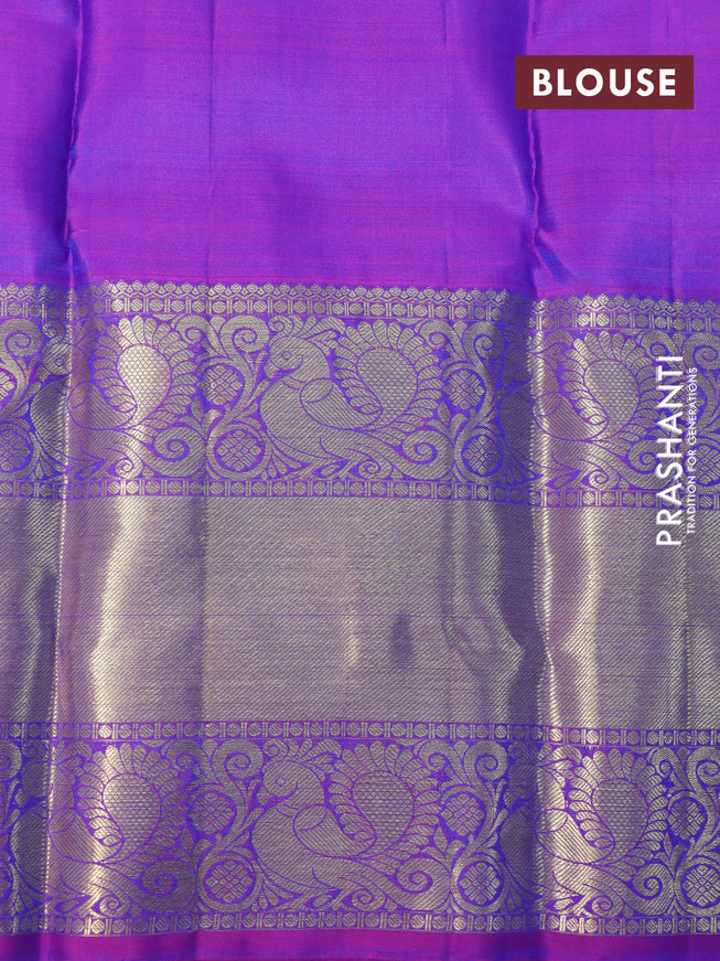 Pure kanchipuram silk saree dual shade of teal blue and purple with zari woven buttas and annam zari woven border