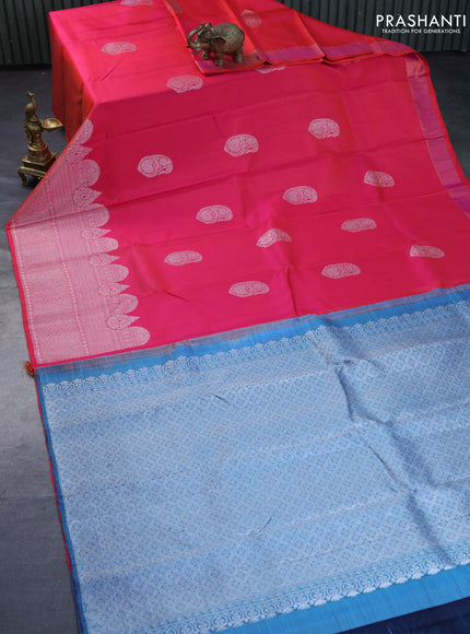 Pure kanchipuram silk saree dual shade of pinkish orange and blue shade with silver zari woven buttas and rich silver zari woven border