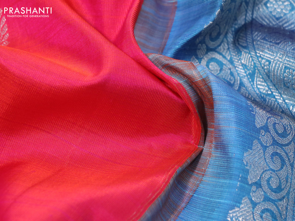 Pure kanchipuram silk saree dual shade of pinkish orange and blue shade with silver zari woven buttas and rich silver zari woven border