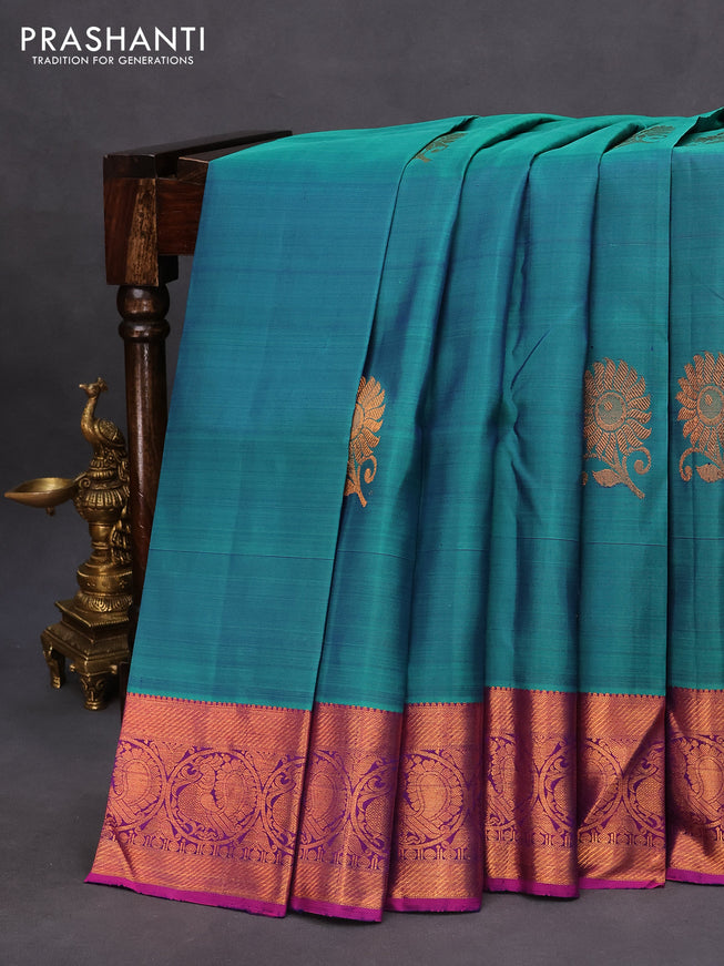 Pure kanchipuram silk saree dual shade of teal blue and pink with copper zari woven buttas and copper zari woven annam border