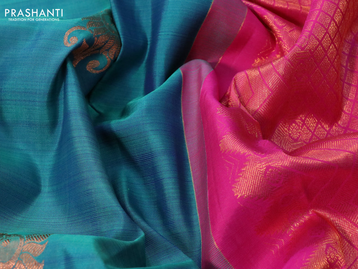 Pure kanchipuram silk saree dual shade of teal blue and pink with copper zari woven buttas and copper zari woven annam border