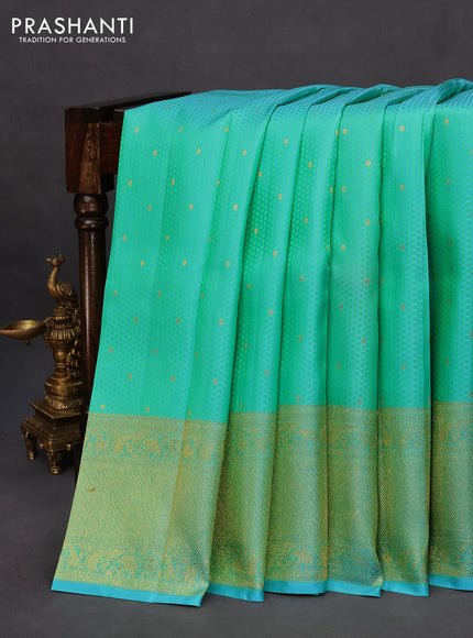 Pure kanchipuram silk saree teal blue shade with allover self emboss & zari buttas and zari woven border