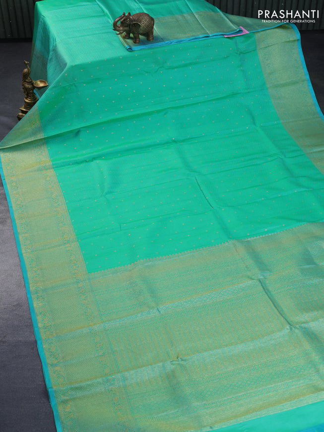 Pure kanchipuram silk saree teal blue shade with allover self emboss & zari buttas and zari woven border