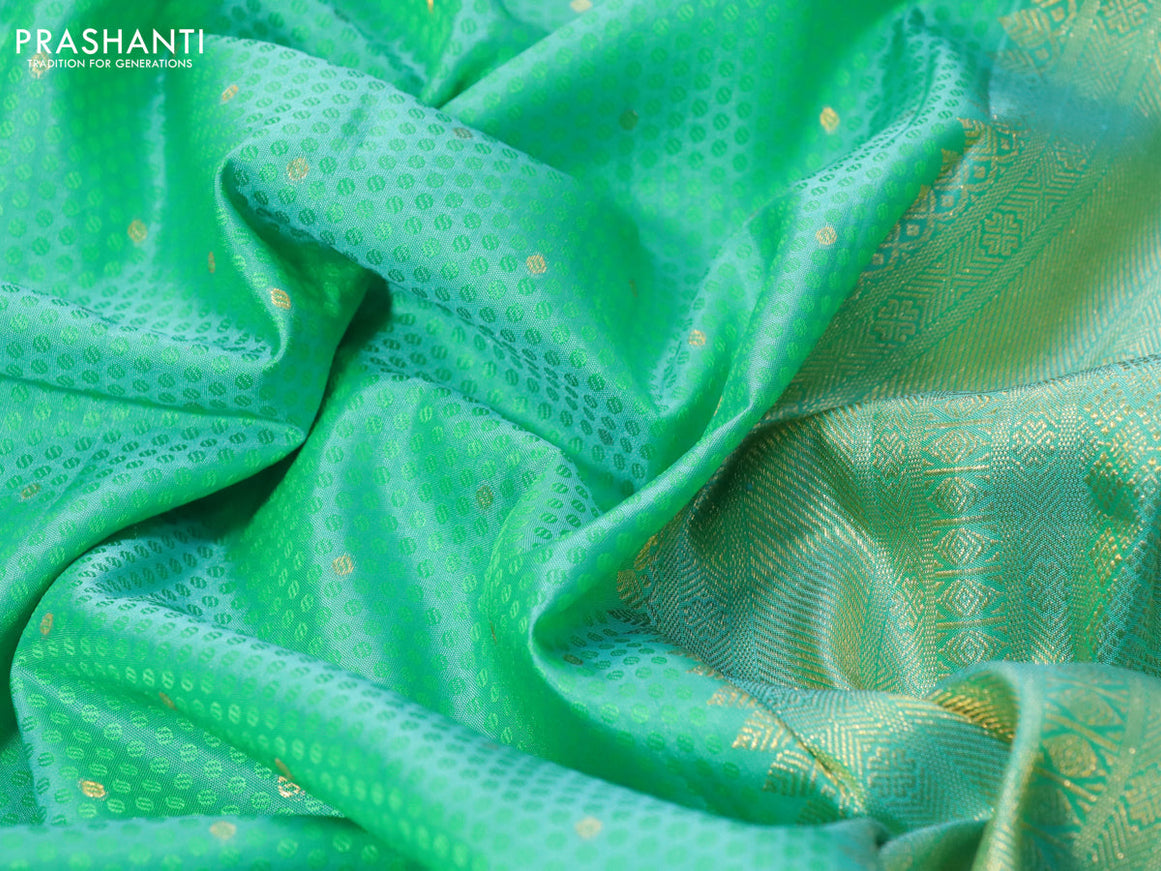 Pure kanchipuram silk saree teal blue shade with allover self emboss & zari buttas and zari woven border