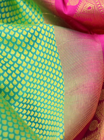 Pure kanchipuram silk saree green and pink with allover self emboss and long rich zari woven border