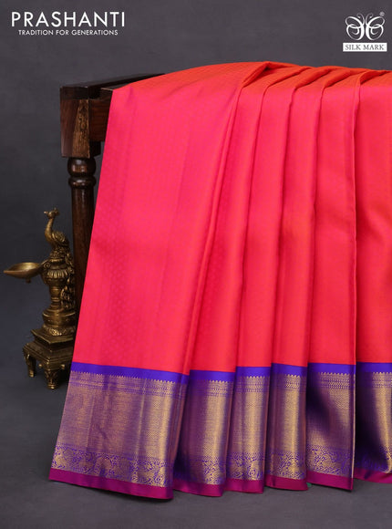 Pure kanchipuram silk saree dual shade of pinkish orange and royal blue with allover self emboss and zari woven border