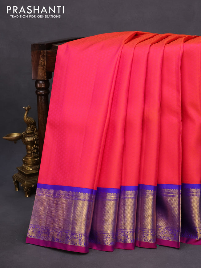 Pure kanchipuram silk saree dual shade of pinkish orange and royal blue with allover self emboss and zari woven border