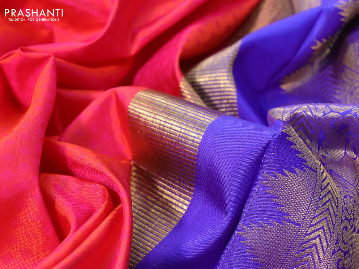 Pure kanchipuram silk saree dual shade of pinkish orange and royal blue with allover self emboss and zari woven border