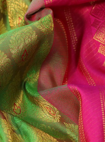 Pure kanchipuram silk saree dual shade of green and pink with allover zari woven butta weaves and rich zari woven border