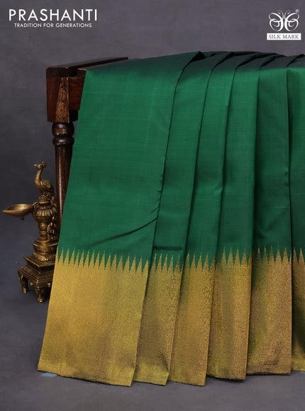 Pure kanchipuram silk saree green and purple with plain body and temple design zari woven simple border