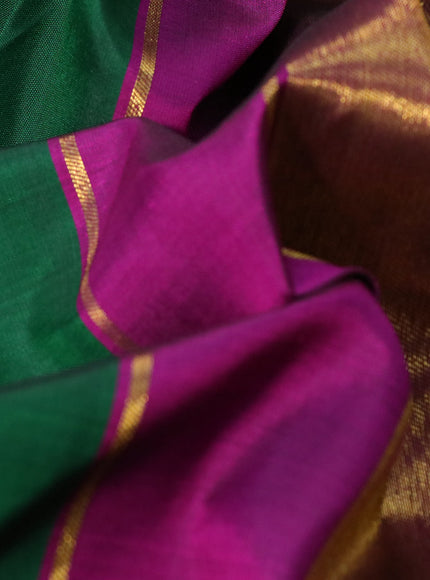 Pure kanchipuram silk saree green and purple with plain body and temple design zari woven simple border