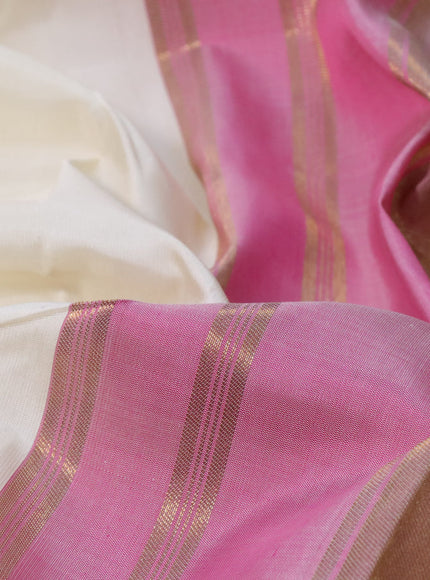 Pure kanchipuram silk saree cream and dual shade pink with plain body and temple design zari woven border