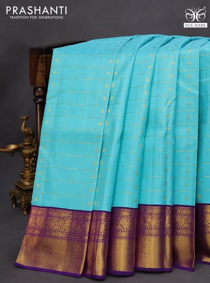 Pure kanchipuram silk saree light blue and blue with allover zari checks & buttas and annam zari woven border