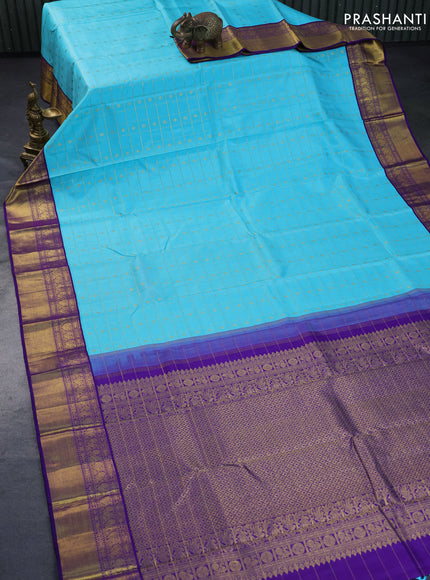 Pure kanchipuram silk saree light blue and blue with allover zari checks & buttas and annam zari woven border