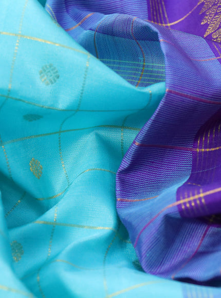 Pure kanchipuram silk saree light blue and blue with allover zari checks & buttas and annam zari woven border