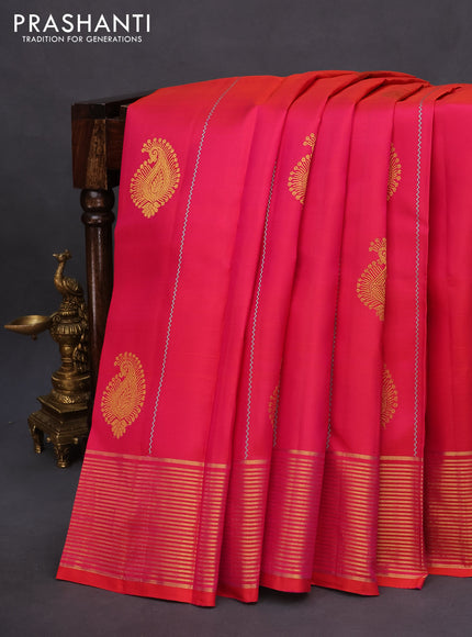 Pure kanchipuram silk saree dual shade of pinkish orange and teal greeen shade with allover thread weaves & zari buttas and zari woven border