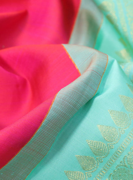 Pure kanchipuram silk saree dual shade of pinkish orange and teal greeen shade with allover thread weaves & zari buttas and zari woven border