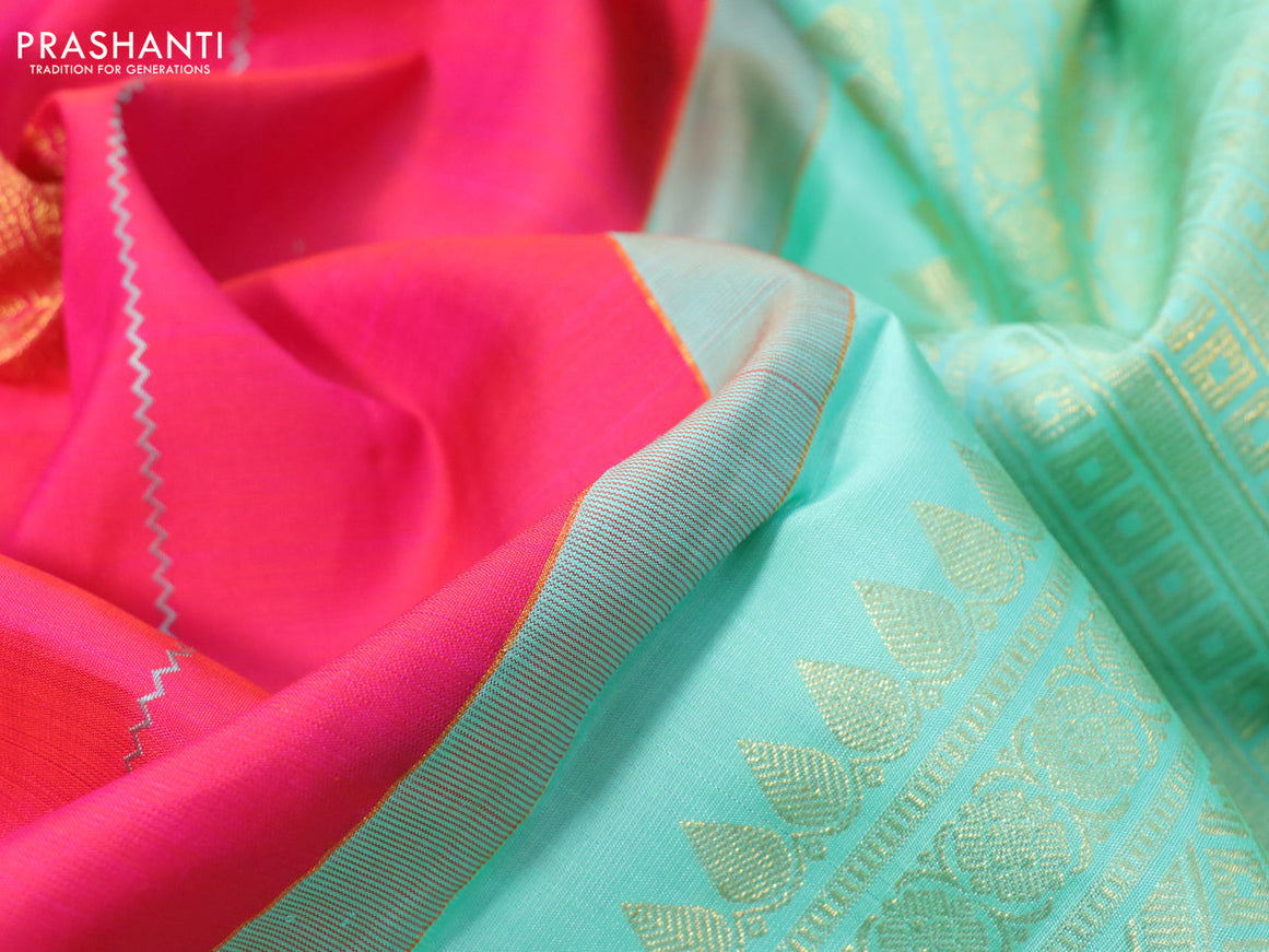 Pure kanchipuram silk saree dual shade of pinkish orange and teal greeen shade with allover thread weaves & zari buttas and zari woven border