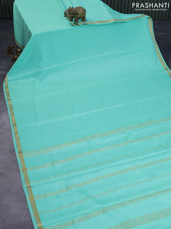 Pure mysore silk saree pastel green shade with plain body and zari woven border