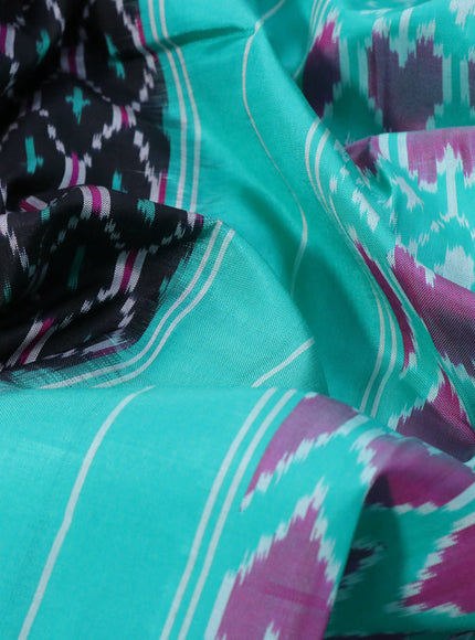 Pochampally silk saree black and teal green with allover ikat weaves and ikat style zari woven border