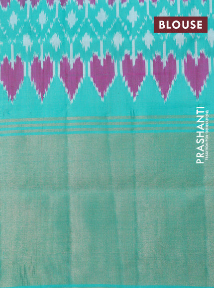 Pochampally silk saree black and teal green with allover ikat weaves and ikat style zari woven border