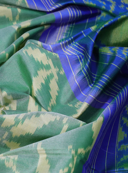 Rajkot patola silk saree dual shade of green and dual shade of bluish green with allover ikat weaves and zari woven border