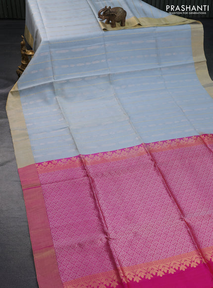 Pure raw silk saree pastel blue shade and dual shade of pinkish orange with silver & gold zari weaves and zari woven border