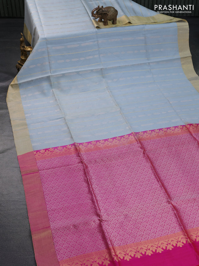 Pure raw silk saree pastel blue shade and dual shade of pinkish orange with silver & gold zari weaves and zari woven border