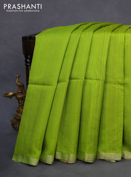 Pure raw silk saree lime green and pink with allover silver zari weaves and silver zari woven piping border