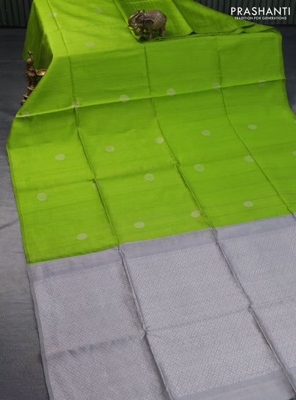 Pure raw silk saree light green and grey with silver zari woven buttas in borderless style