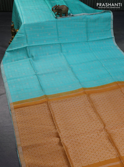 Pure raw silk saree light blue and mustard yellow with allover silver zari checks & buttas and silver zari woven border