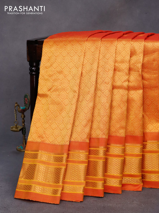 Gadwal silk saree dual shade of mustard yellow with allover zari woven brocade weaves and zari woven border & paithani design pallu