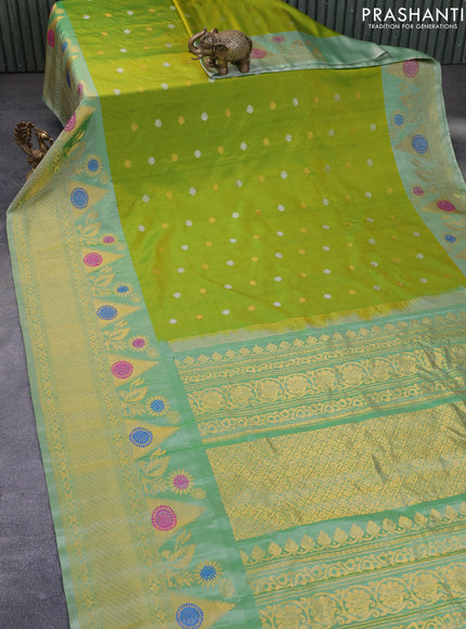 Gadwal silk saree dual shade of green and pastel green shade with silver & copper zari woven buttas and long thread & zari woven border