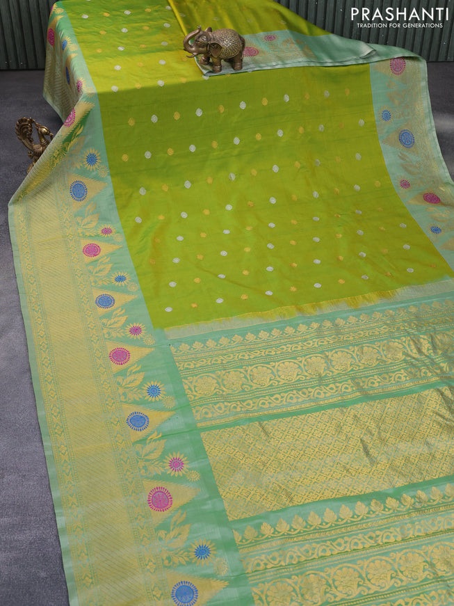 Gadwal silk saree dual shade of green and pastel green shade with silver & copper zari woven buttas and long thread & zari woven border