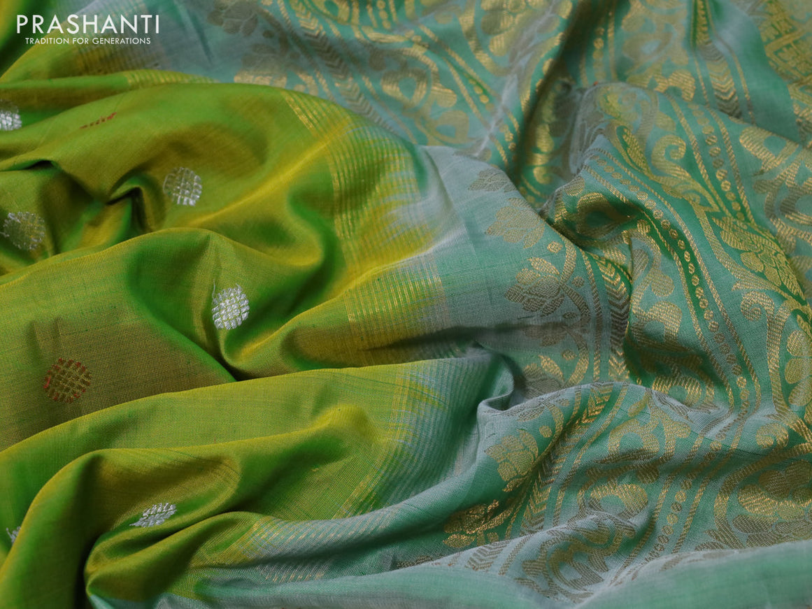 Gadwal silk saree dual shade of green and pastel green shade with silver & copper zari woven buttas and long thread & zari woven border