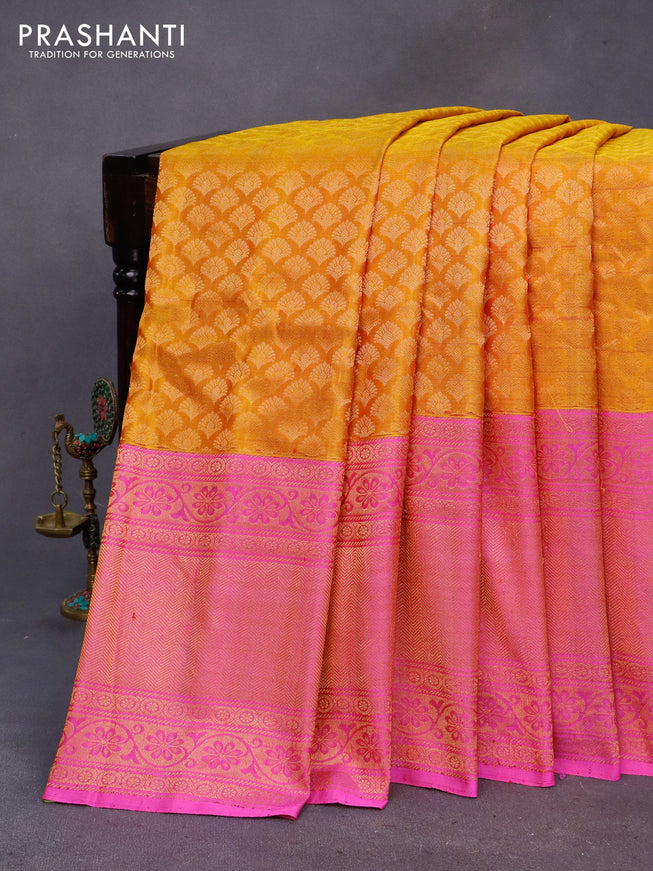 Gadwal silk saree mustard yellow and pink with allover zari woven brocade weaves and long zari woven border