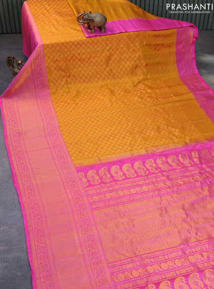 Gadwal silk saree mustard yellow and pink with allover zari woven brocade weaves and long zari woven border