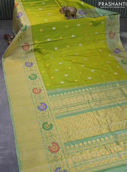 Gadwal silk saree dual shade of green and pastel green shade with silver & gold zari woven buttas and long thread & zari woven border