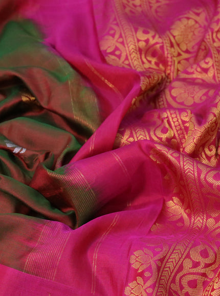 Gadwal silk saree dual shade of reddish green and dark pink with silver & gold zari woven buttas and long zari woven border