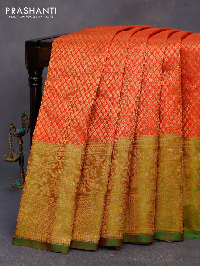 Gadwal silk saree reddish orange and dual shade of green with allover zari woven brocade weaves and long floral zari woven border