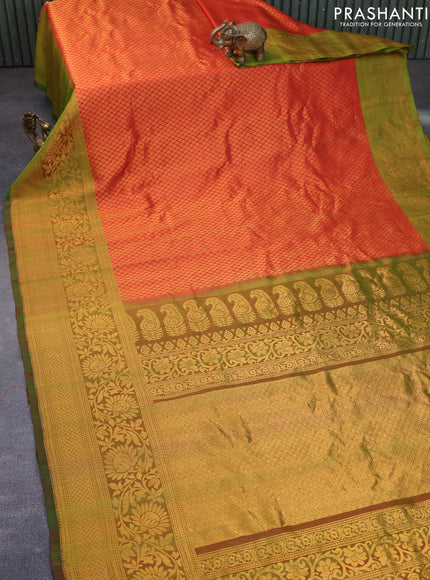 Gadwal silk saree reddish orange and dual shade of green with allover zari woven brocade weaves and long floral zari woven border