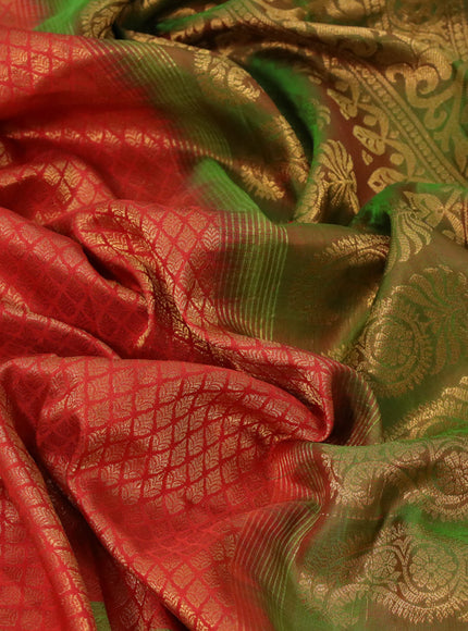 Gadwal silk saree reddish orange and dual shade of green with allover zari woven brocade weaves and long floral zari woven border